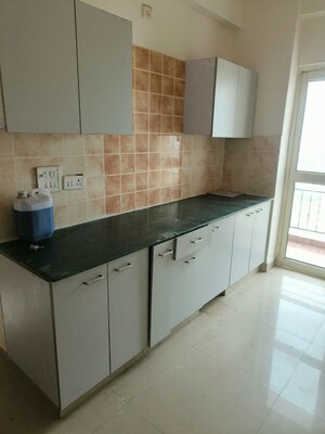 Kitchen in 2 BHK Apartment at Aims Golf City, Sector 75 – for Rent