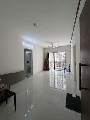 Living Room in 1 BHK Apartment at Runwal Gardens, Dombivli East – for Rent