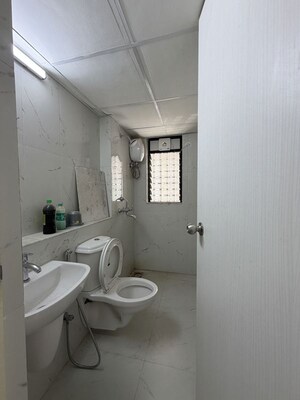 Bathroom in 1 BHK Apartment at Runwal Gardens, Dombivli East – for Rent