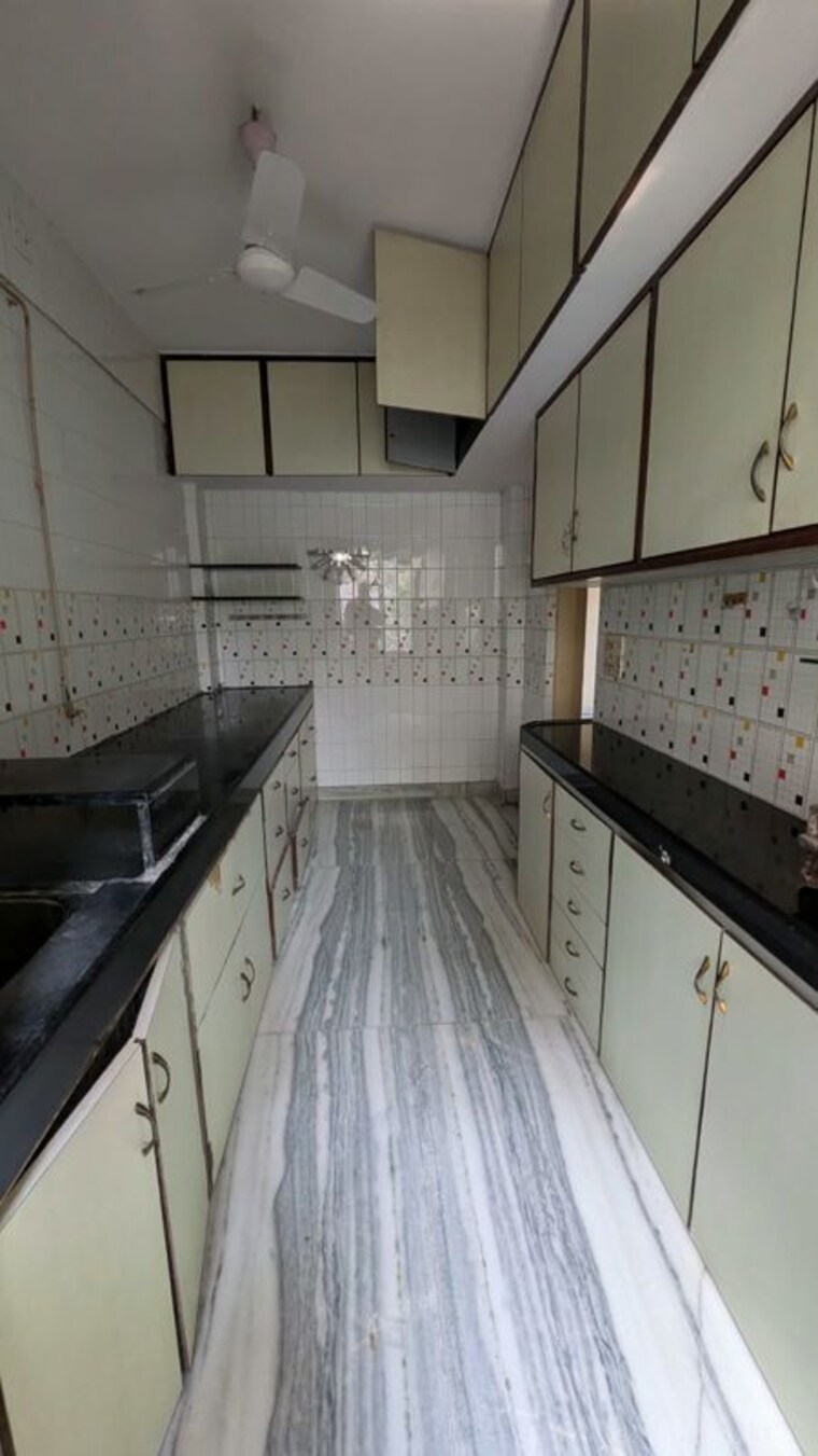 Kitchen, om-ashish-chs 3 Bedroom 950 Sq.Ft. Penthouse In Malad West Mumbai 10758937
