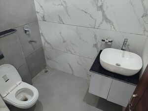 Bathroom in 3 BHK Builder Floor at Motia Blue Ridge, Dhakoli – for Sale