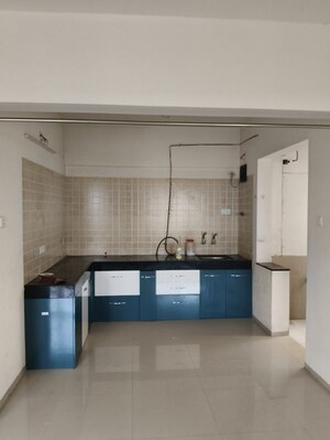 Kitchen in 3 BHK Apartment at Kunal Iconia, Mamurdi – for Rent