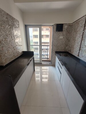 Kitchen in 2 BHK Apartment at Raunak Residency Thane, Pokhran Road No One – for Rent