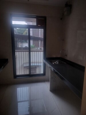 Kitchen in 1 BHK Apartment at Naupada – for Sale