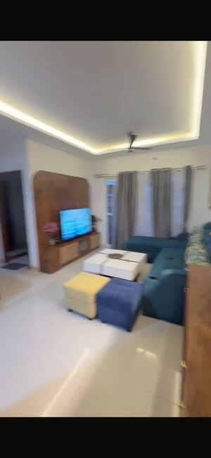 Living Room in 2 BHK Apartment at Adarsh Greens, Kogilu – for Rent
