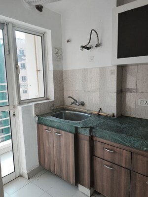Kitchen in 2.5 BHK Apartment at Paras Tierea, Sector 137 – for Sale