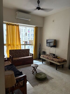 Living Room in 1 BHK Apartment at Lodha Amara, Kolshet Road – for Rent