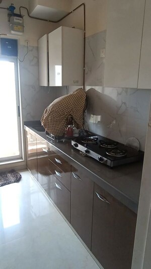 Kitchen in 1 BHK Apartment at Vihang Vermont, Ghodbunder Road – for Sale