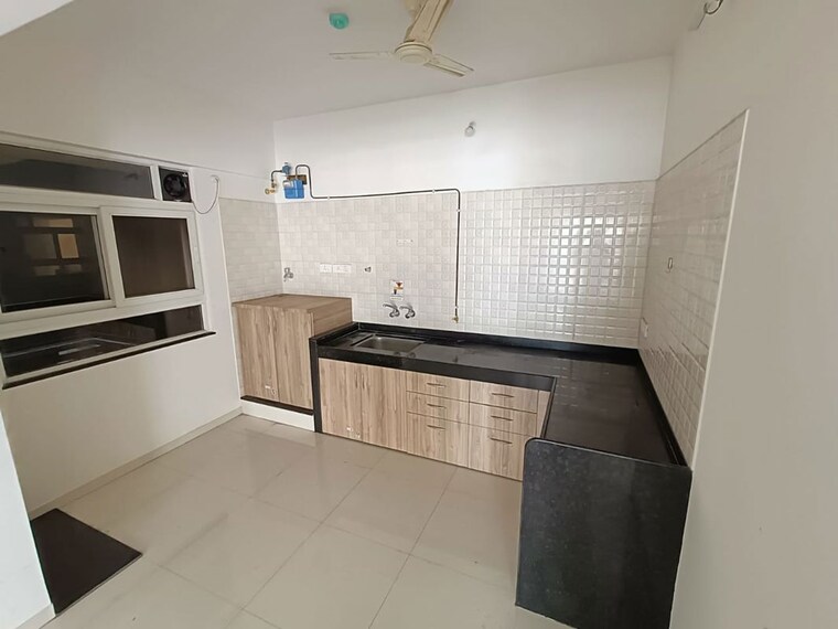 Kitchen, nyati-elysia 2 Bedroom 718 Sq.Ft. Apartment In Kharadi Pune 10761528