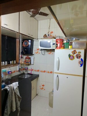 Kitchen in 1 BHK Apartment at New Om Complex CHSL, Mira Road – for Sale