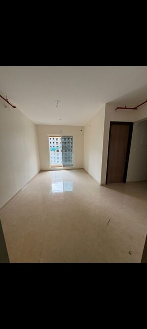 Building Lobby in 2 BHK Apartment at Dosti Tulip, Balkum Pada – for Rent