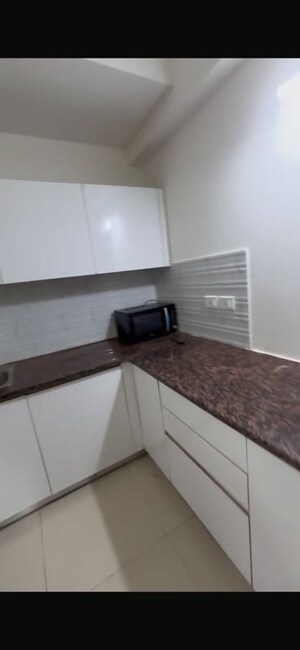 Kitchen in 1 BHK Apartment at Sunworld Arista, Sector 168 – for Rent