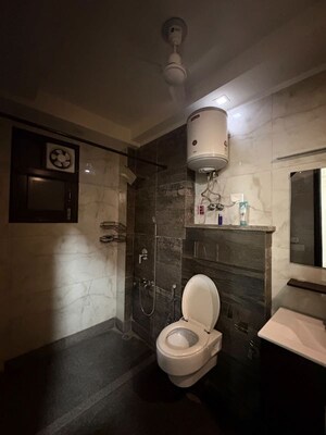 Bathroom in 4 BHK Builder Floor at Rajouri Garden – for Rent