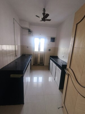 Kitchen in 2 BHK Apartment at Highland Tower, Lokhandwala – for Rent