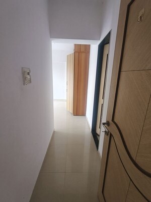 Building Lobby in 2 BHK Apartment at Highland Tower, Lokhandwala – for Rent