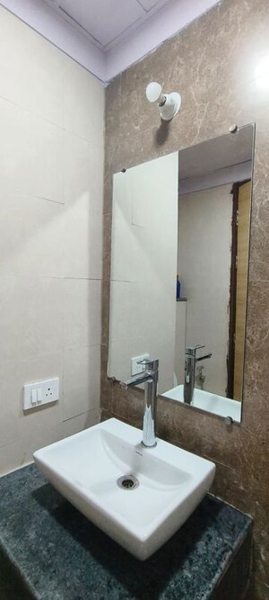 Bathroom in Studio Apartment at Gaur City Mall, Sector 4 Greater Noida – for Sale