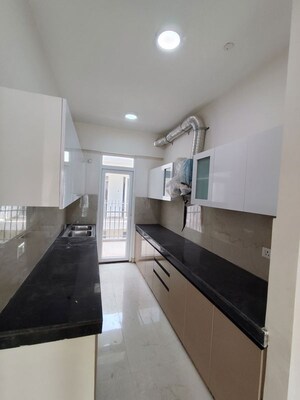 Kitchen in 2.5 BHK Apartment at Smart World Gems, Sector 89 – for Rent