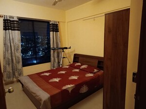 Bedroom in 2 BHK Apartment at Kolte Patil Margosa Heights, Mohammadwadi – for Rent