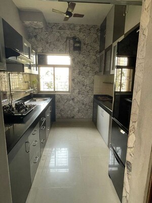 Kitchen in 2.5 BHK Apartment at Vijay Enclave, Waghbil – for Rent