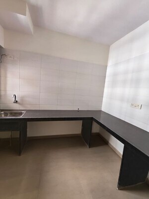Kitchen in 2 BHK Apartment at Unnathi Woods Phase 3, Ghodbunder Road – for Sale