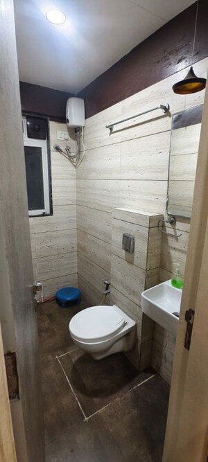 Bathroom in 1 BHK Apartment at Omkar Signet, Malad East – for Rent