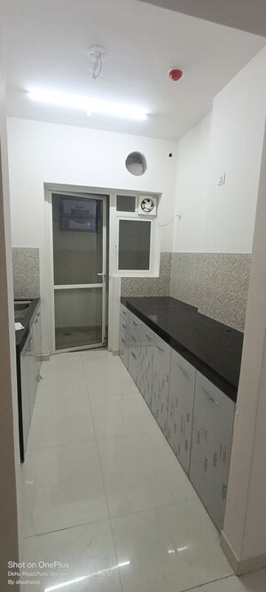 Kitchen in 2 BHK Apartment at Raj Heramba Venkatesh Imperia, Tathawade – for Rent
