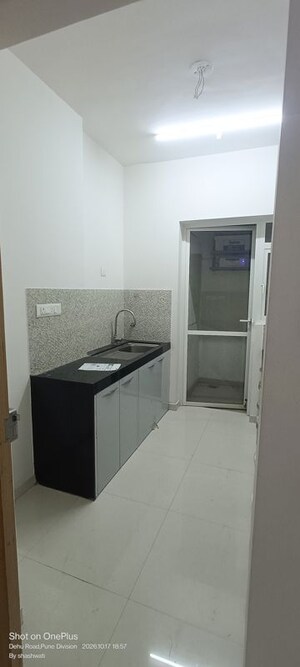 Kitchen in 2 BHK Apartment at Raj Heramba Venkatesh Imperia, Tathawade – for Rent