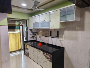 Kitchen in 2.5 BHK Apartment at Shree Satya Shankar Residency, Manpada – for Rent