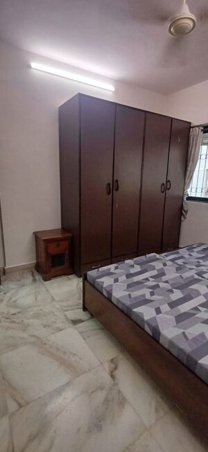 Bedroom in 3 BHK Apartment at Andheri CHS, Andheri West – for Rent