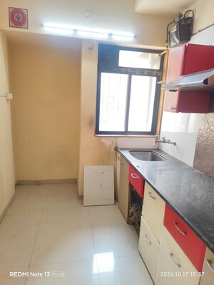 Kitchen in 2 BHK Apartment at Puranik Hometown Phase II, Ghodbunder Road – for Sale