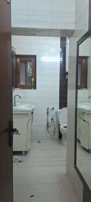 Washroom in 2.5 BHK Apartment at Sarita Vihar – for Rent