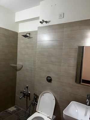 Bathroom in 3 BHK Apartment at HN Safal Applewoods Orchid heights, Sp Ring Road – for Sale