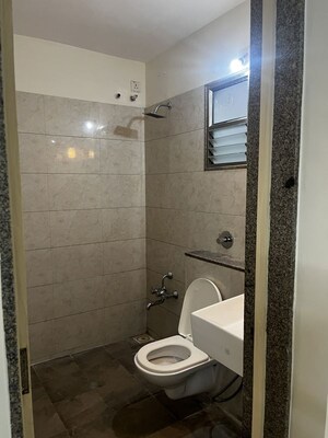 Bathroom in 3 BHK Apartment at HN Safal Applewoods Orchid heights, Sp Ring Road – for Sale