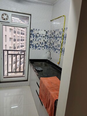 Kitchen in 1 BHK Apartment at Raunak Bliss Phase A3, Ghodbunder Road – for Rent