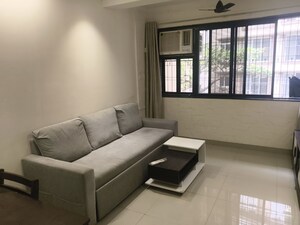 Living Room in 1 BHK Apartment at Vile Parle West – for Rent