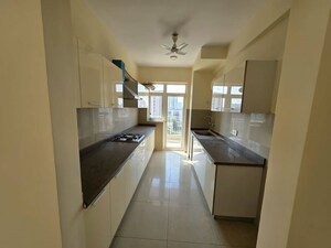 Kitchen in 3.5 BHK Apartment at Emaar Palm Gardens, Sector 83 – for Sale