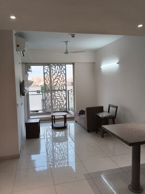 Living Room in 1.5 BHK Apartment at Godrej Golf Links Evoke, Sector 27 Yamuna Expressway – for Rent