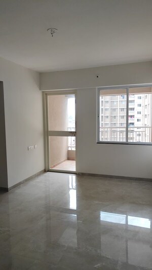 Living Room in 2 BHK Apartment at Lotus Urban Homes, Charholi Budruk – for Rent
