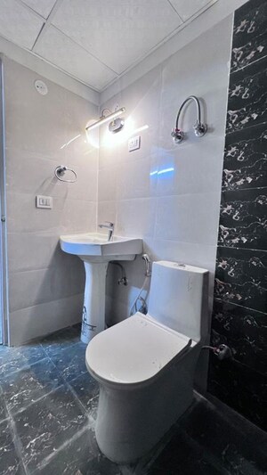 Bathroom in 3 BHK Apartment at Migsun Roof, Raj Nagar Extension – for Rent