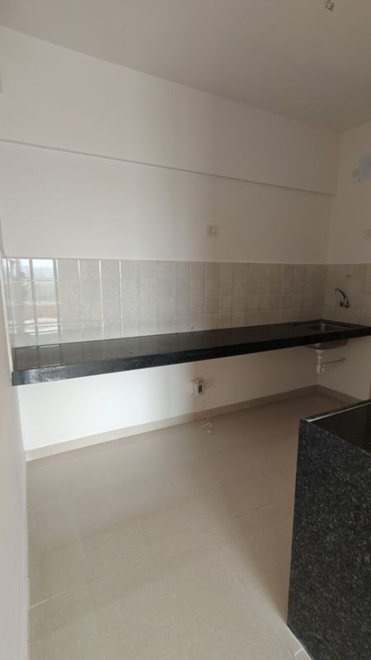 Kitchen, shapoorji-pallonji-joyville-hadapsar-annexe 2 Bedroom 669 Sq.Ft. Apartment In Hadapsar Pune 10766599