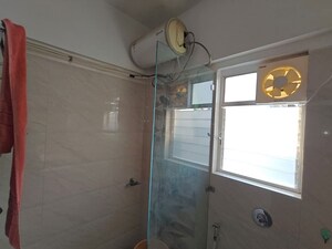 Bathroom in 2 BHK Apartment at Kolte Patil Langston, Kharadi – for Rent