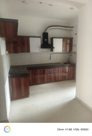 Kitchen in 2 BHK Apartment at Aims Golf City, Sector 75 – for Rent
