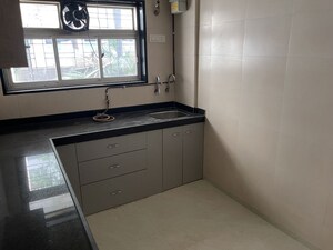 Kitchen in 2 BHK Apartment at Nirman Kutir, Yari Road – for Rent