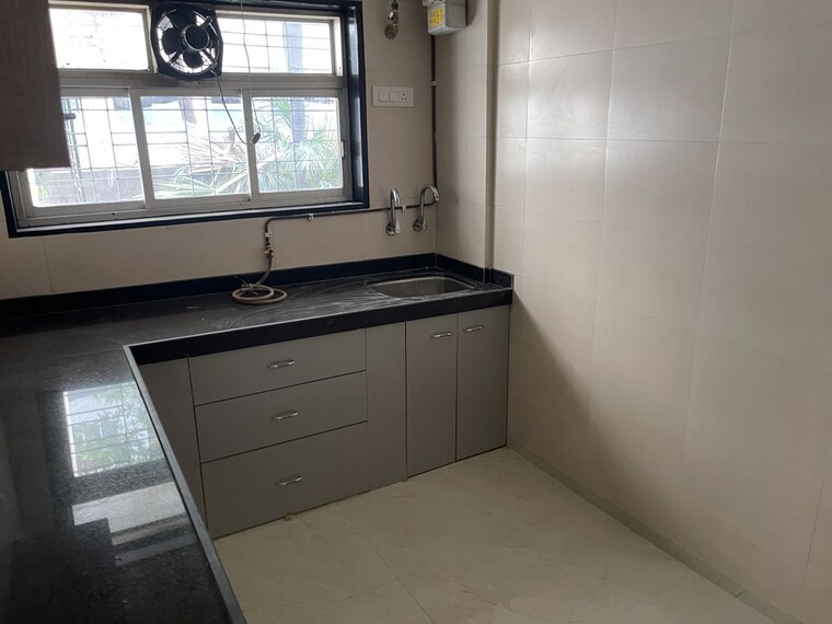 Kitchen, nirman-kutir 2 Bedroom 900 Sq.Ft. Apartment In Yari Road Mumbai 10767389