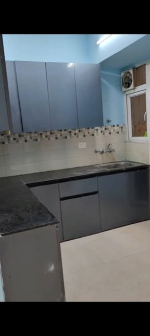 Kitchen in 2 BHK Apartment at Signature Global Orchard Avenue, Sector 93 – for Rent