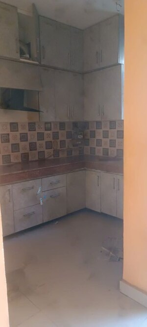 Kitchen in 2 BHK Apartment at Uninav Heights Phase I, Raj Nagar Extension – for Rent