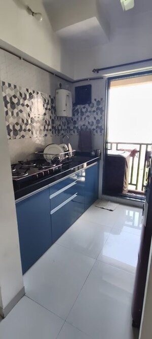 Kitchen in 1 BHK Apartment at Raunak Unnathi Woods Phase 7 A And B, Ghodbunder Road – for Rent