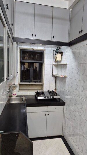 Kitchen in 2 BHK Apartment at Adarsh Nagar Society, Worli – for Rent
