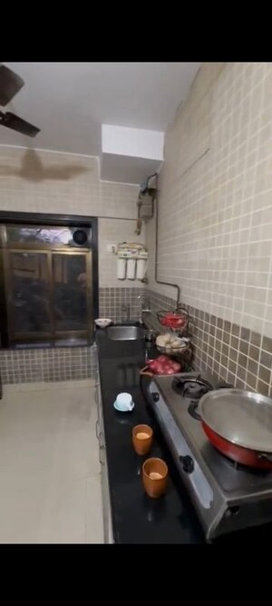 Kitchen in 1 BHK Apartment at Andheri CHS, Andheri West – for Rent