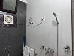 Bathroom in 3 BHK Builder Floor at Mahavir Enclave – for Sale